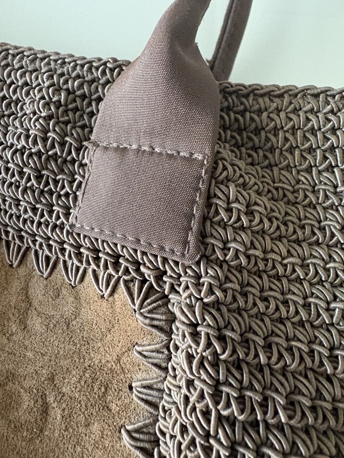 Tightly Woven bag Brown .68% Cotton/32 % olefin with man made material trim.