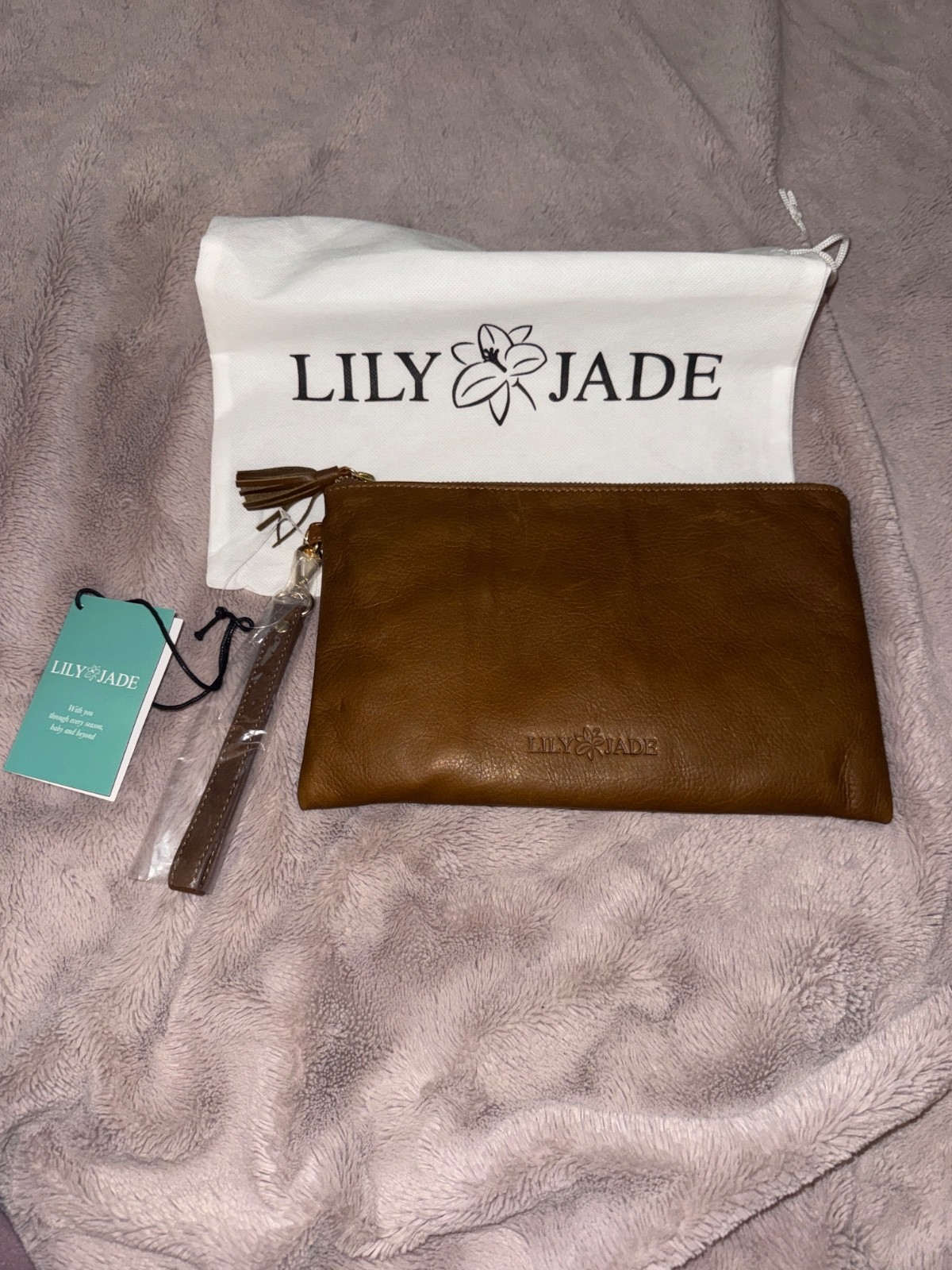 Lily Jade wristlet, no interior pockets. Jade color lining. Full leather