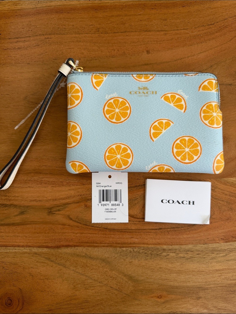 NWT Coach Corner Zip Wristlet with Orange Print