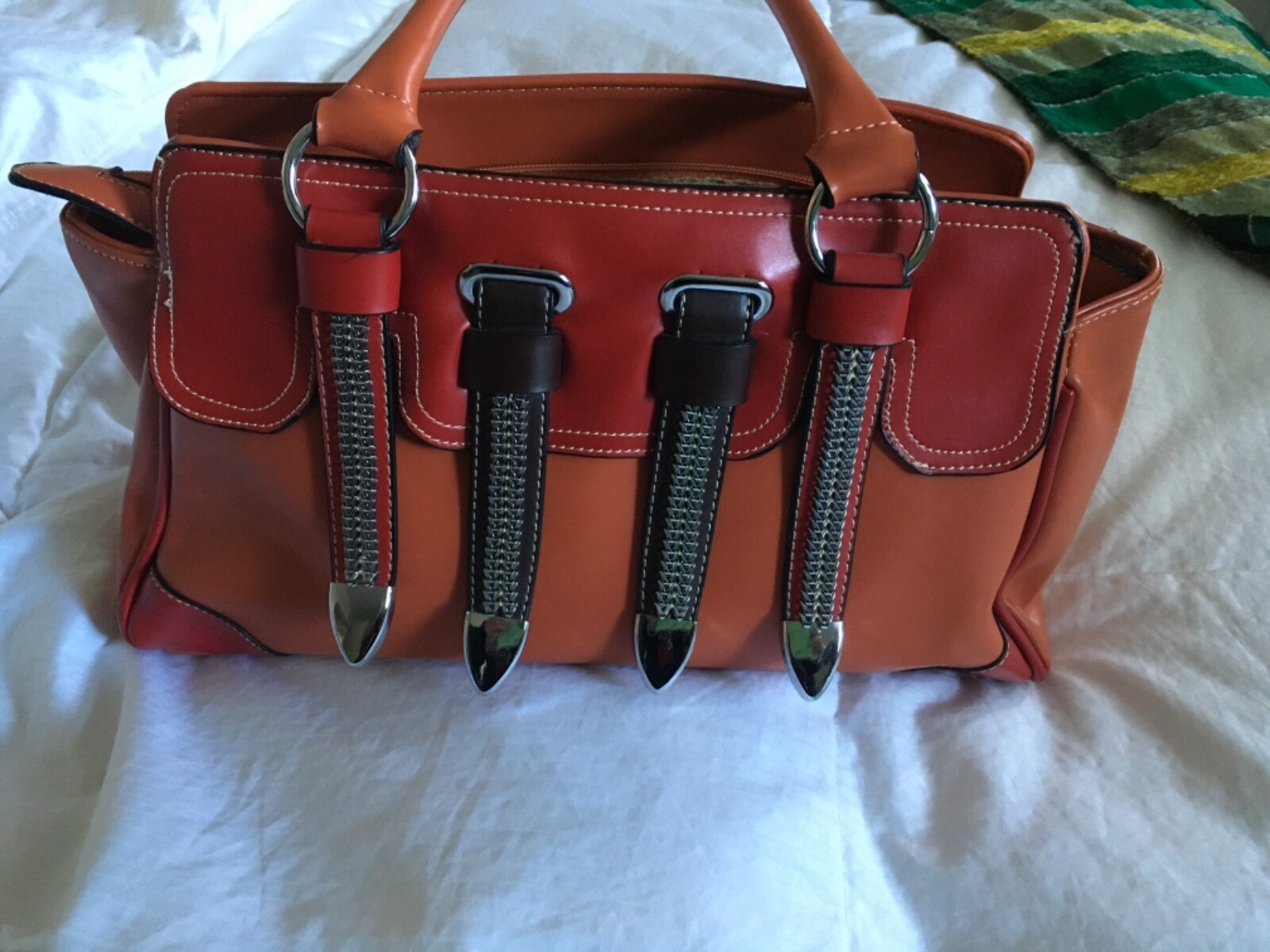 Fun funky red orange and brown handbag with silver accents and straps Never used
