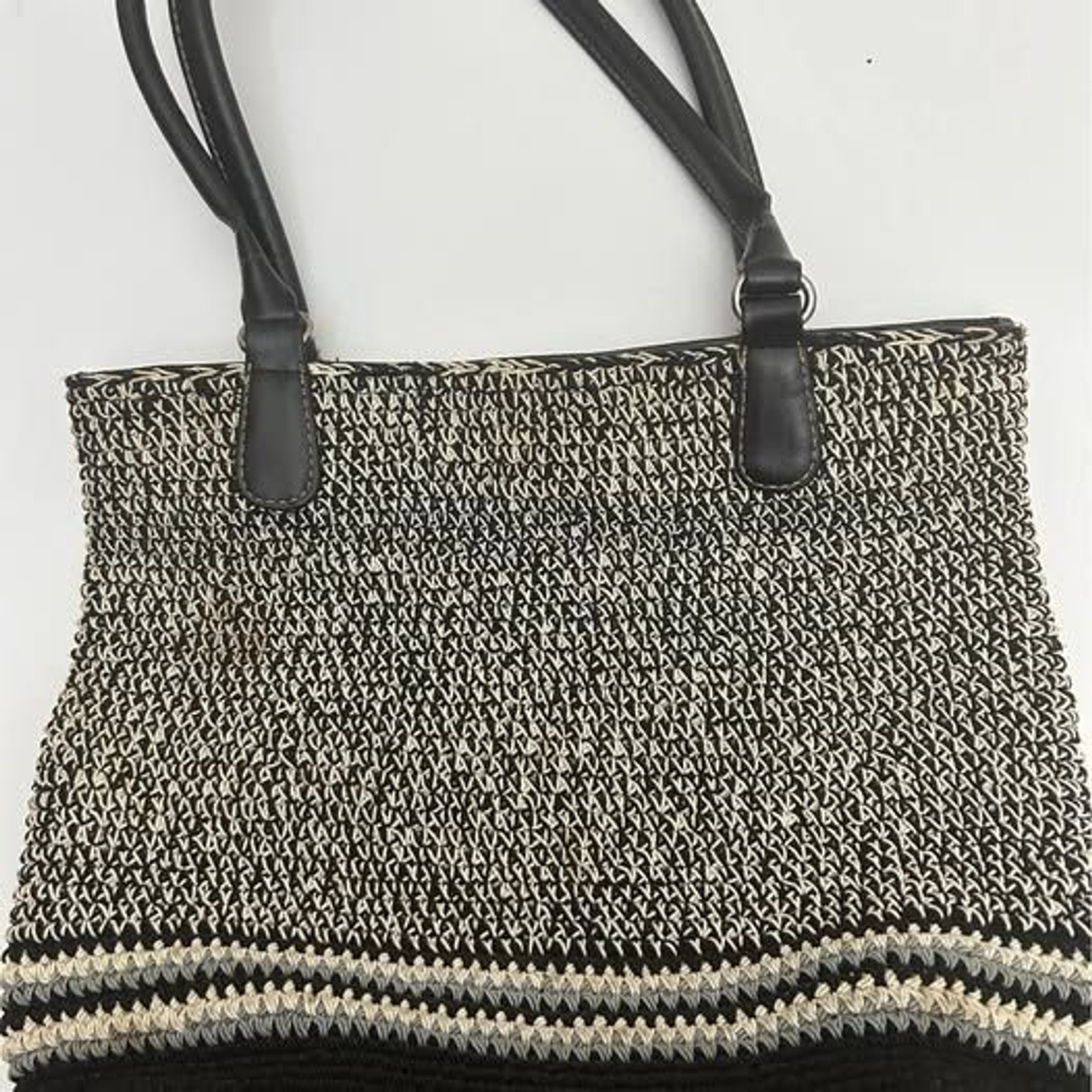 Gray, beige and black women’s handbag