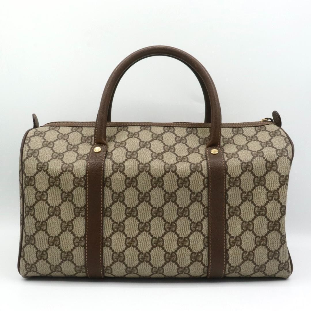Gucci PVC canvas leather handbag, brown.