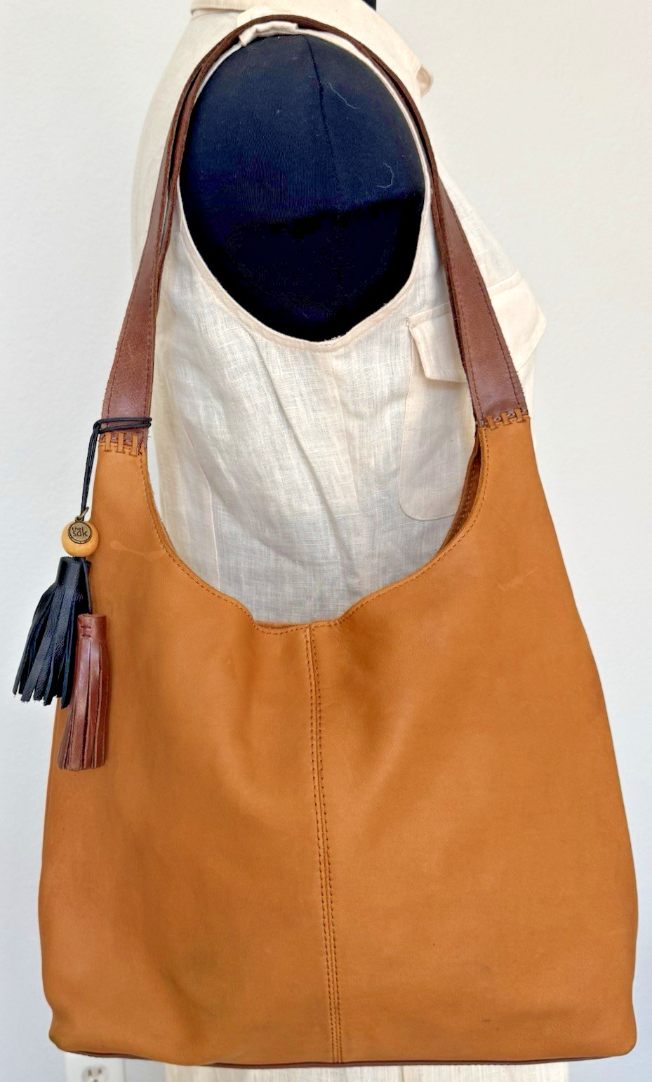 The Sak Women’s Huntley Leather Hobo Bag Metro Sling Pebbled Tan with Tassel