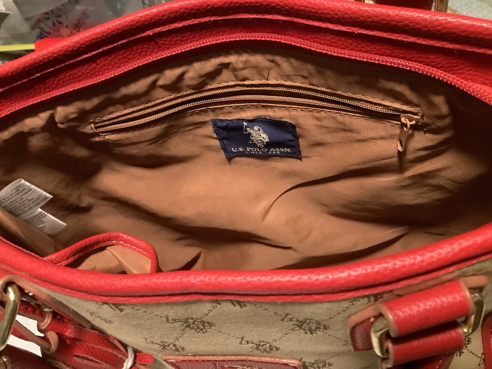 Polo Assn. cotton-blended logo fabric shoulder bag w/red vinyl trim and handles.