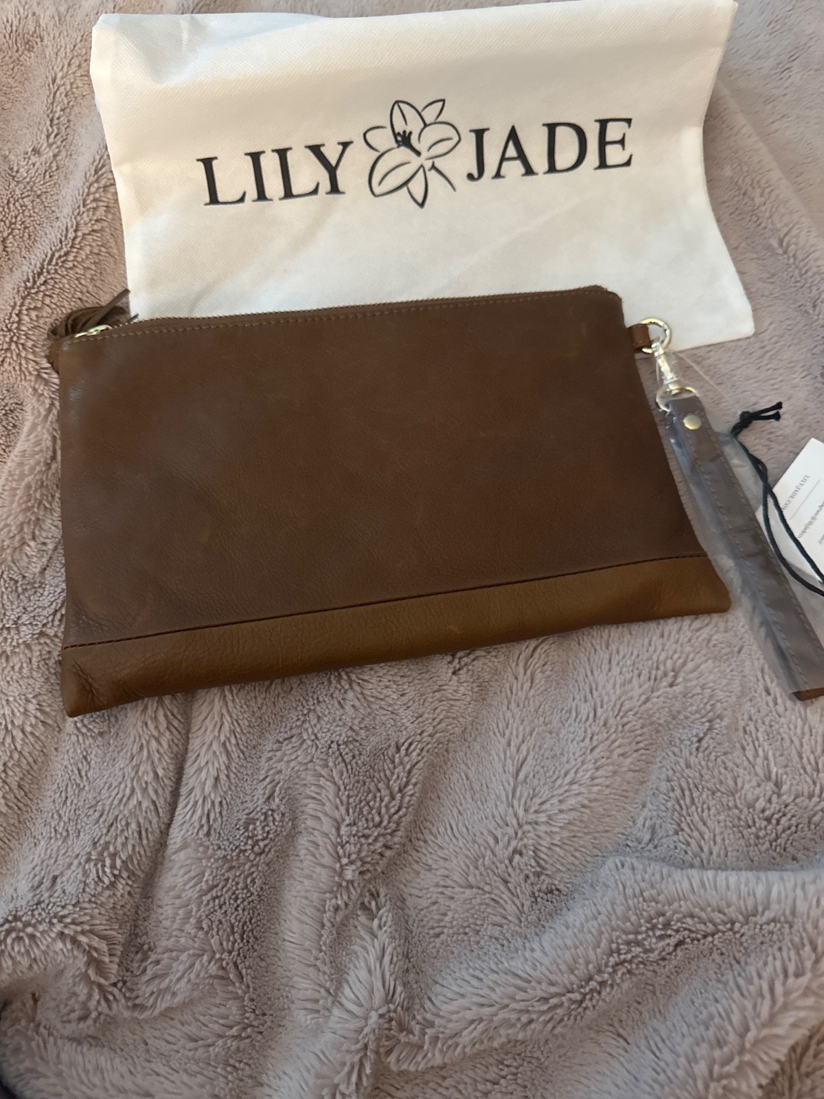 Lily Jade wristlet, no interior pockets. Jade color lining. Full leather