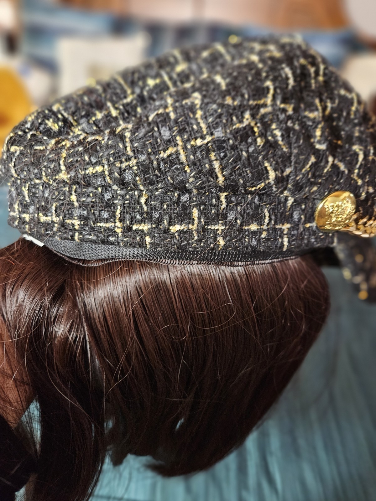 Set of Bradgley Mischka croosbody bag and unbranded hat with wig attached to it.