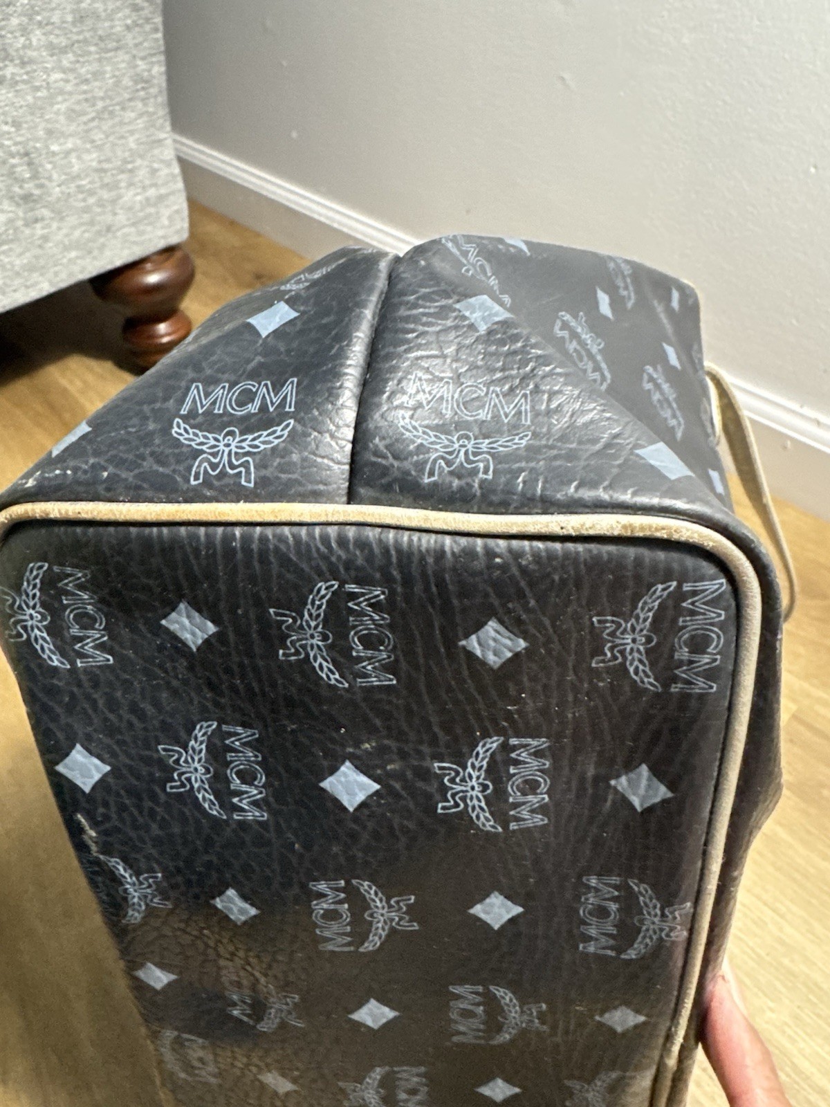 MCM black & gray tote bag with repeating white MCM logo and diamond pattern