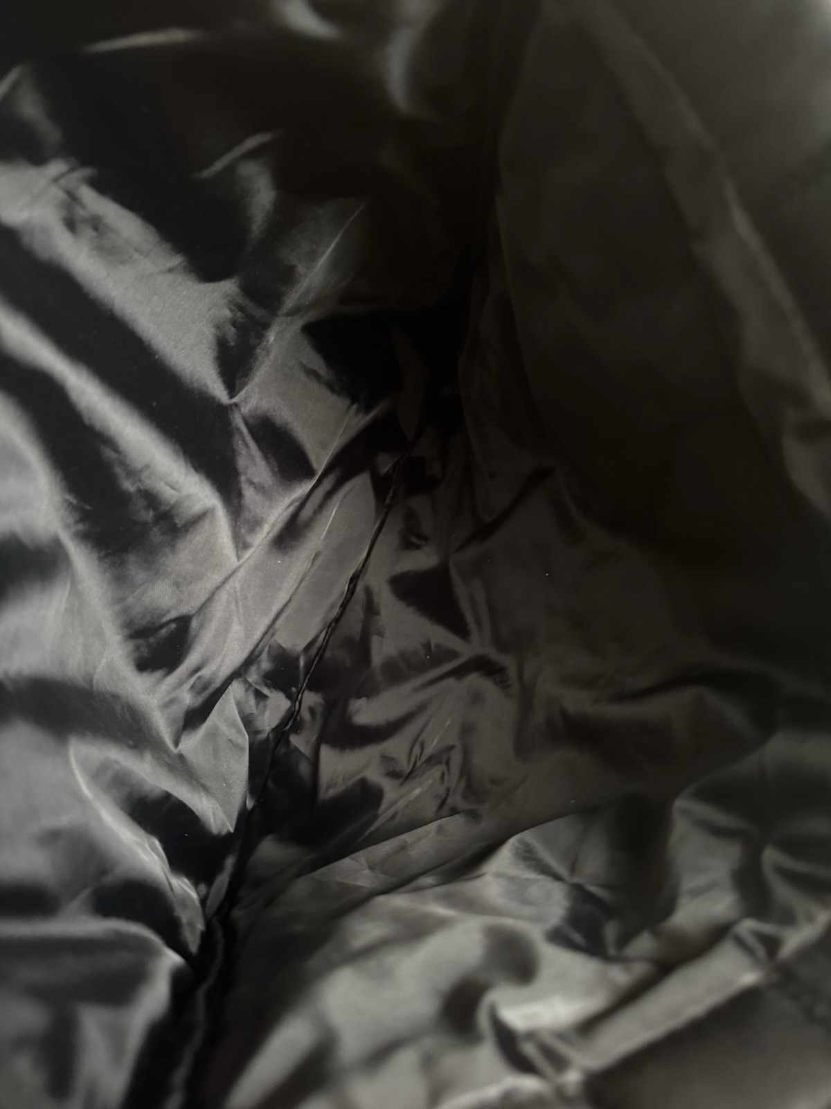 Billie Eilish tote bag features quilted black design a subtle logo on the front