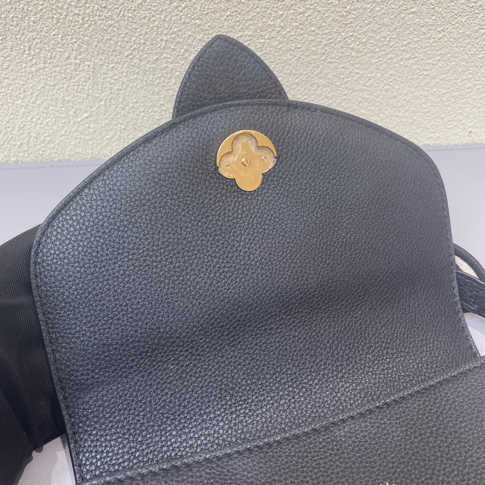 Louis Vuitton Pont 9 black calfskin crossbody bag with gold-tone hardware.