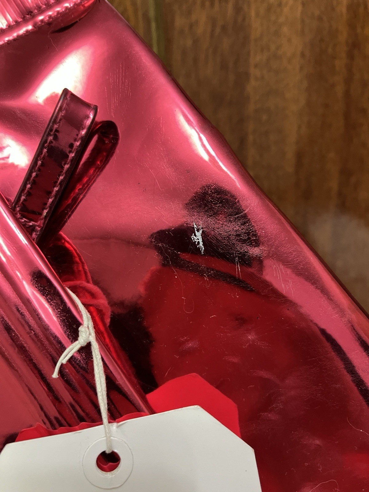 The iconic pink Maison Martin Margiela x H&M clutch shaped like a candy wrapper