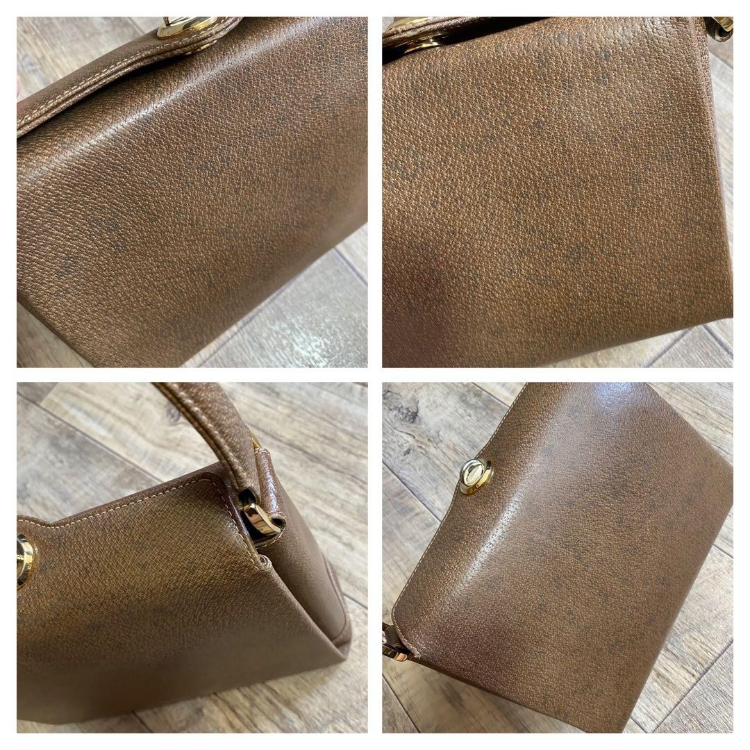 GUCCI Handbag Brown Leather Turn-lock Closure Size: WxH7 in. Strap: 18.9″