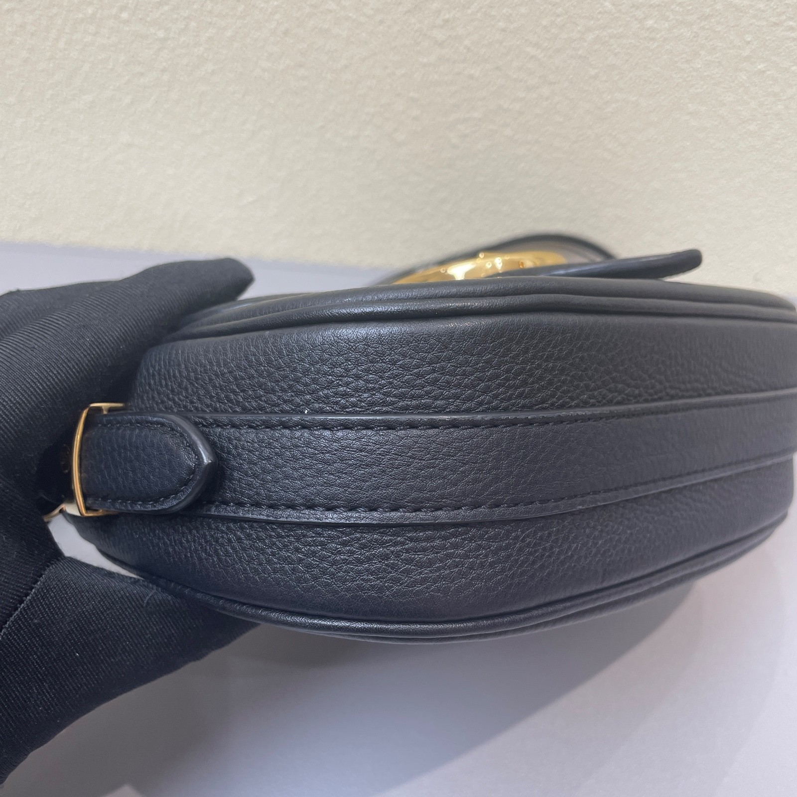 Louis Vuitton Pont 9 black calfskin crossbody bag with gold-tone hardware.