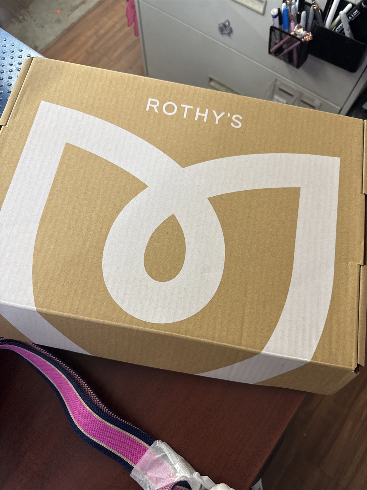 Rothy’s The Travel Sling Gold Stripe Bag In Optic