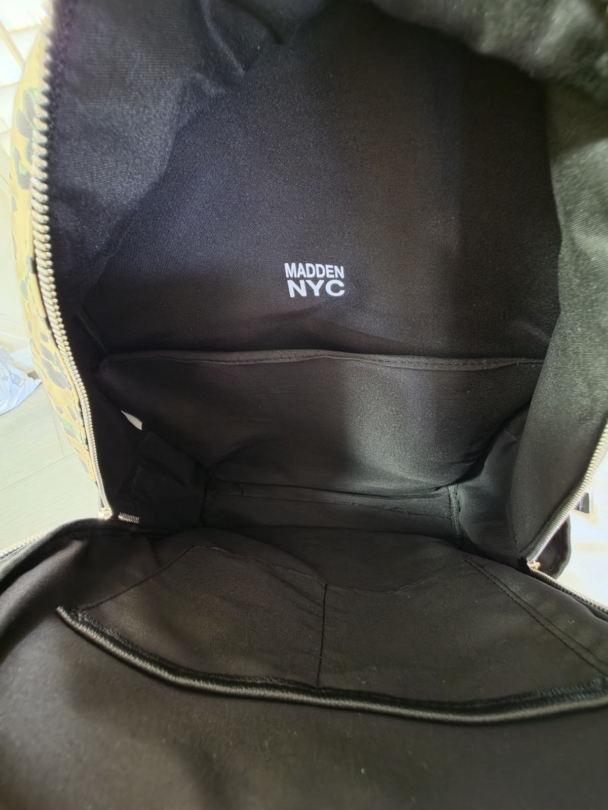 Madden NYC Black Medium Backpack Multi-Zip Padded Pockets Silver Charm