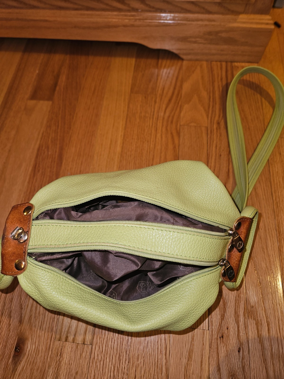 Valentina Italian leather convertible sling bag in a mint green And Brown Trim
