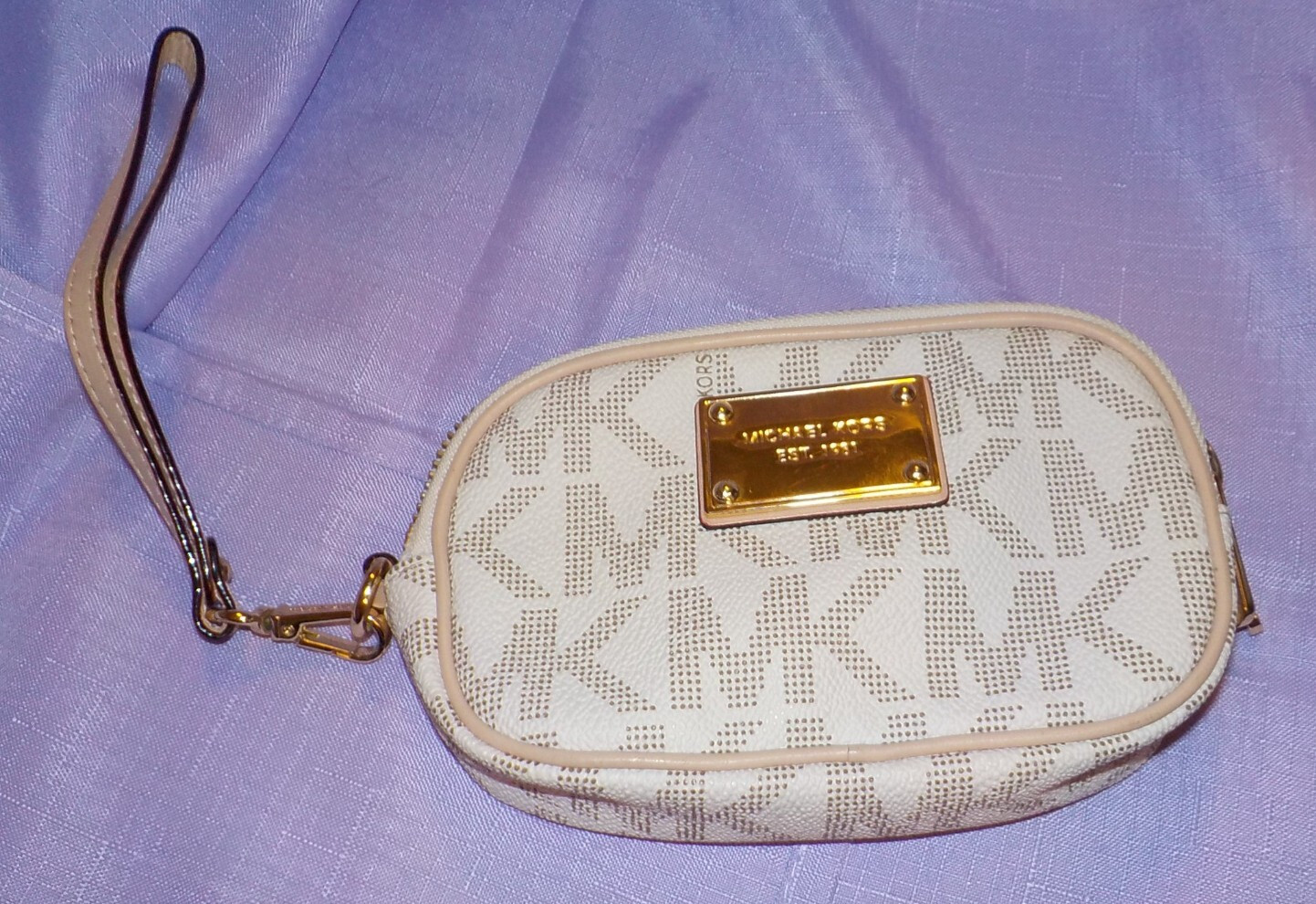 Michael Kors light tan Monogram Wristlet 6″W x 3.5″ x 1.5″D