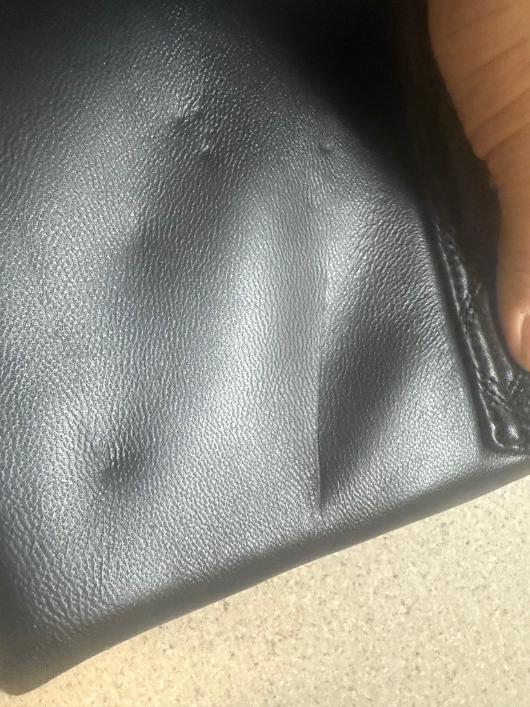 small Kurt Geiger London Macro Kensington Drench leather shoulder bag in black.