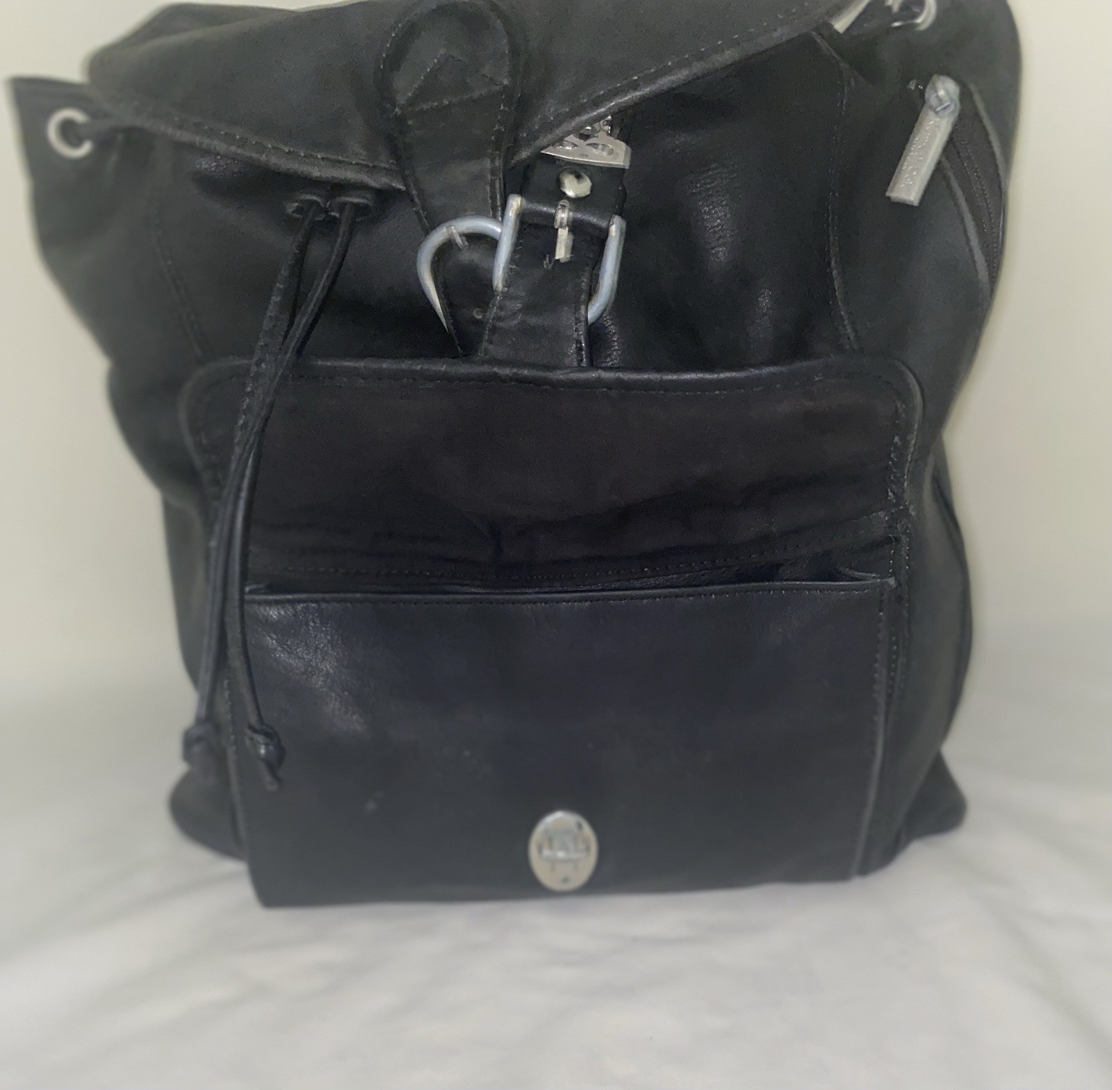 Kenneth Cole Black Drawstring Backpack w/ Buckle Closure, Outer Pockets, Logo.