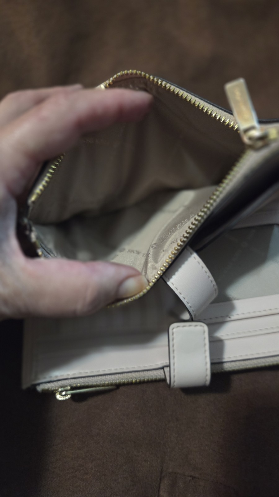 Michael Kors Jet Set Travel wristlet features the signature logo PVC monogram