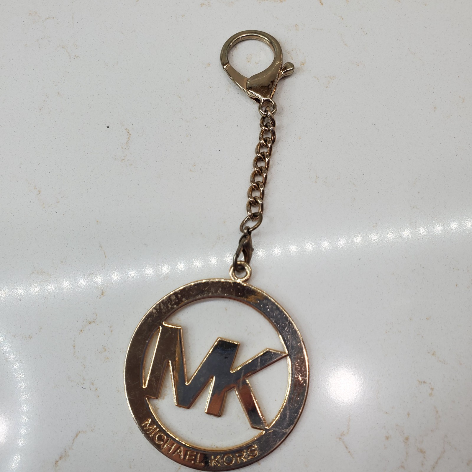 Michael Kors Round Gold Tone Clip On MK Purse Charm w Carabiner