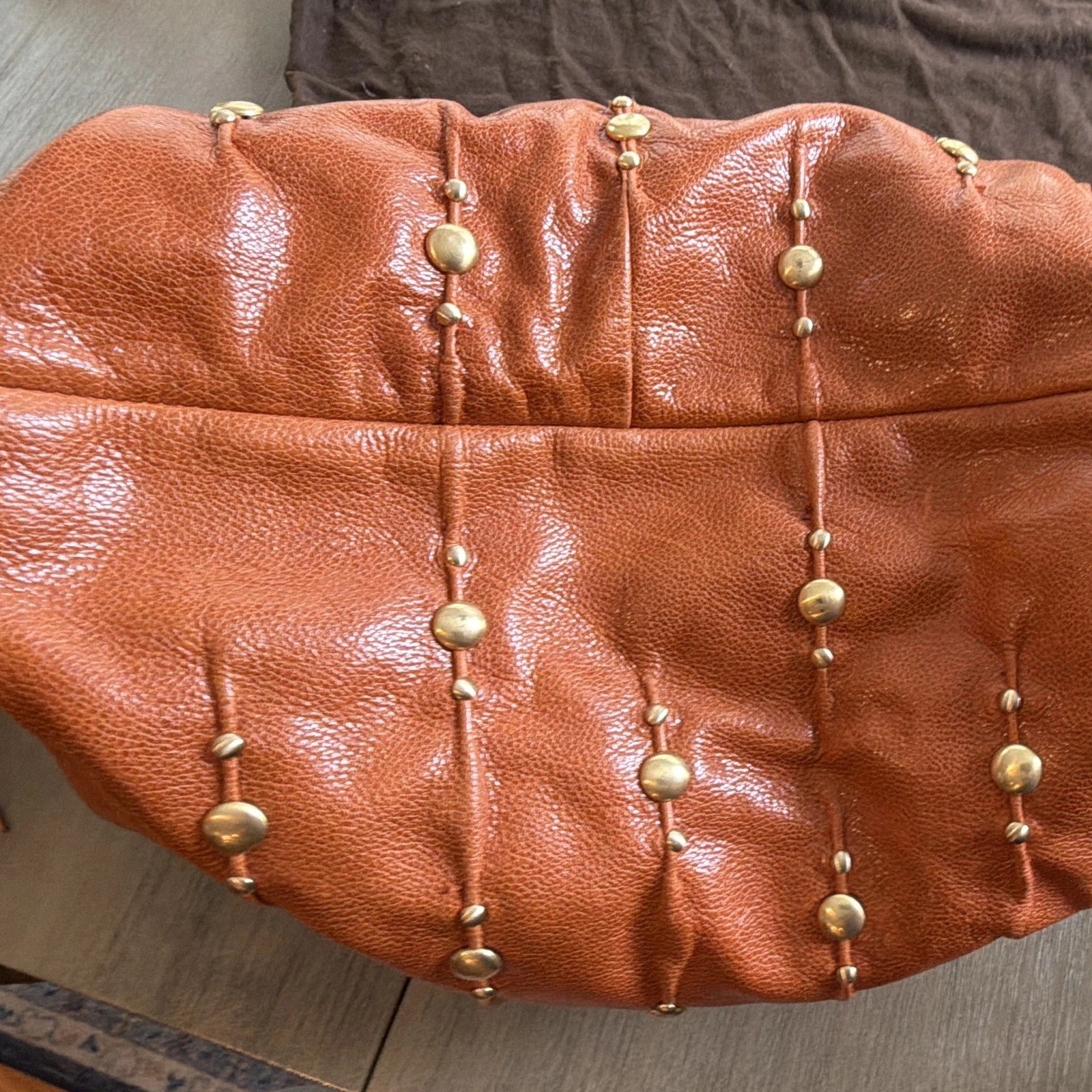 Isabella  Fiore Brown Studded Leather Drawstring Shoulder Bag – Tasseled Strap