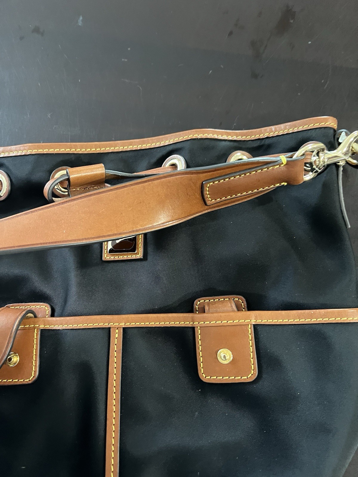 Dooney & Bourke Black Bucket Bag with Brown Leather Trim & Detachable Strap