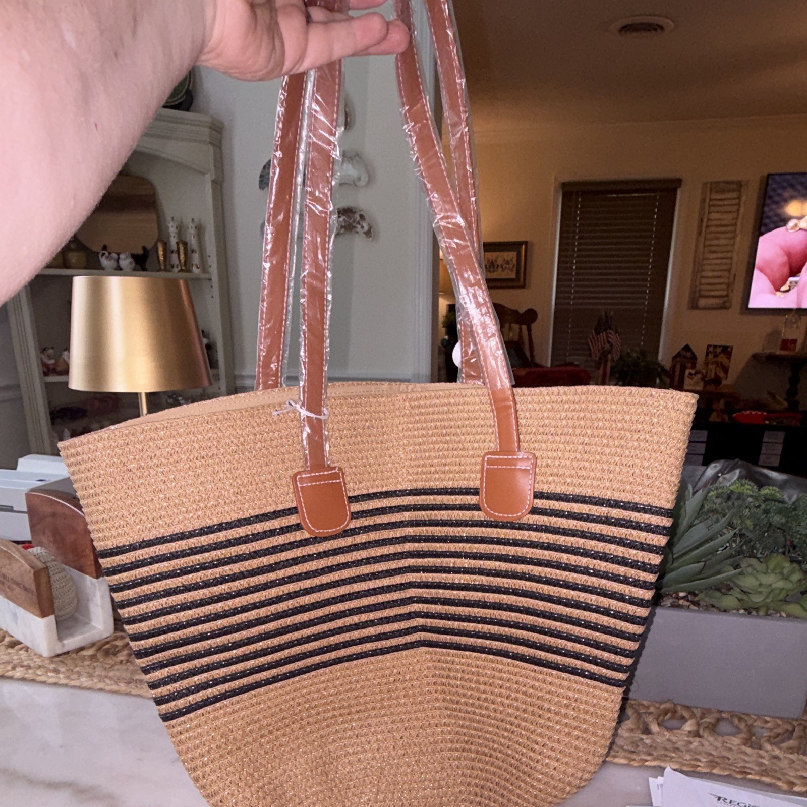NWOT Shoulder tote bag khaki tan with black stripe. Made of 100% paper.