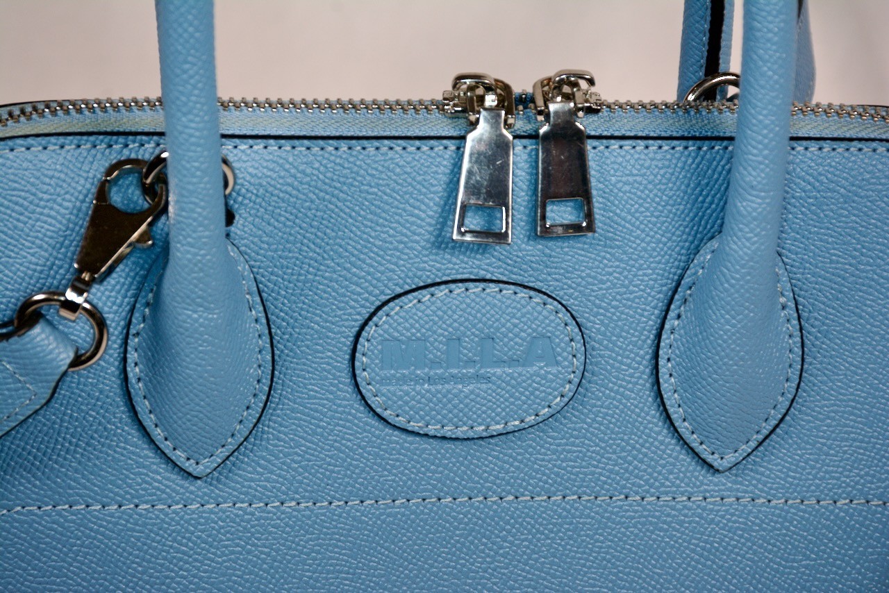 M. I. L. A. Light Blue purse w/handle and strap. Elegant. Little used