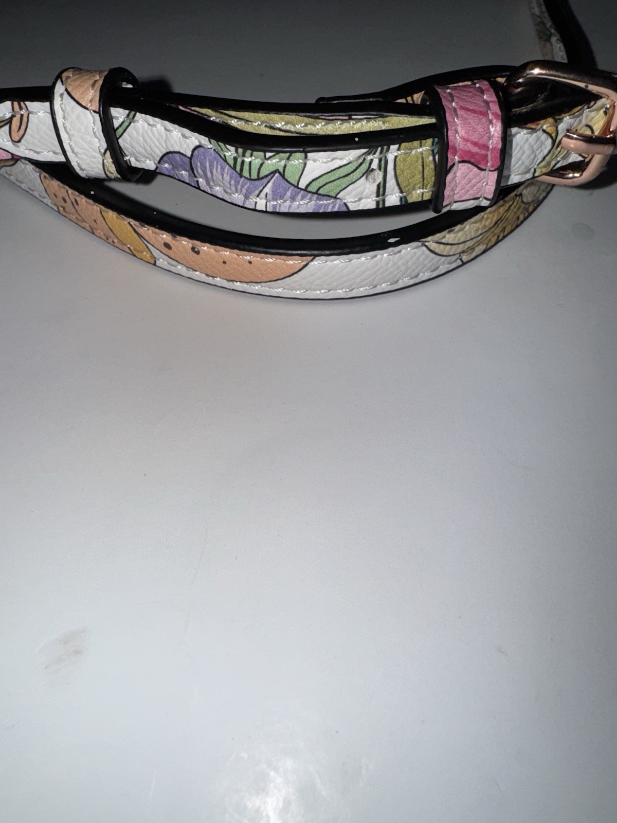 marbled acrylic box clutch bag with a gold clasp and strap