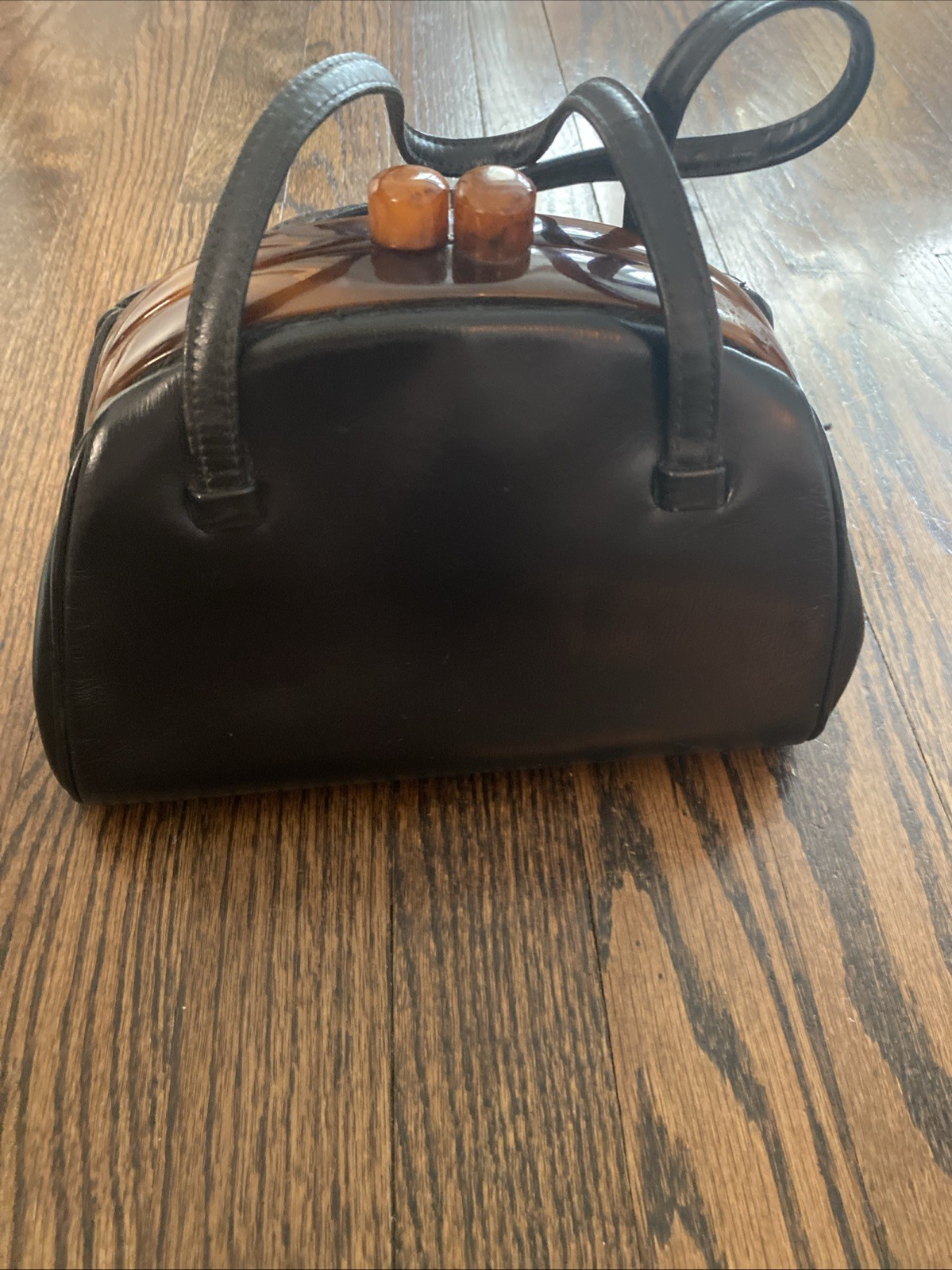 Black Leather Mel Ton Top Handle Bag With Acrylic Closure