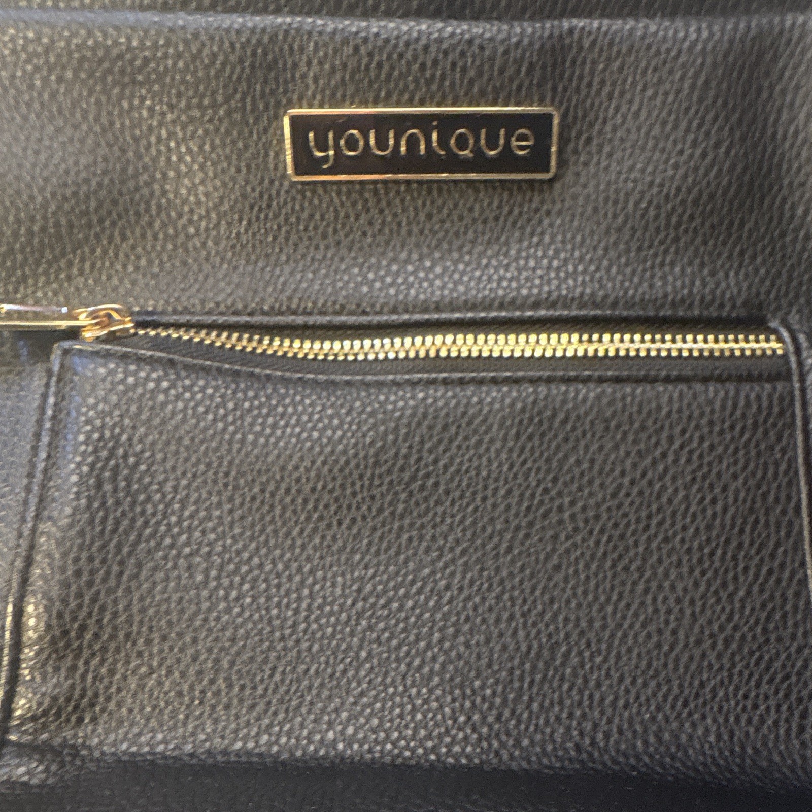 Younique Black Pebbled Backpack with Gold Hardware & Zip, Pockets, Purple Lining