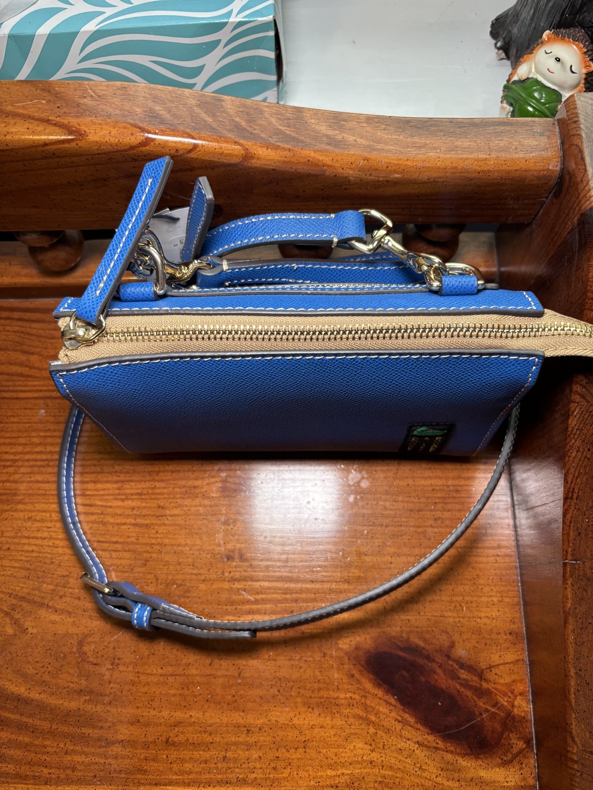 Dooney & Bourke Pebbled Leather Small Janine Crossbody in the color French Blue.