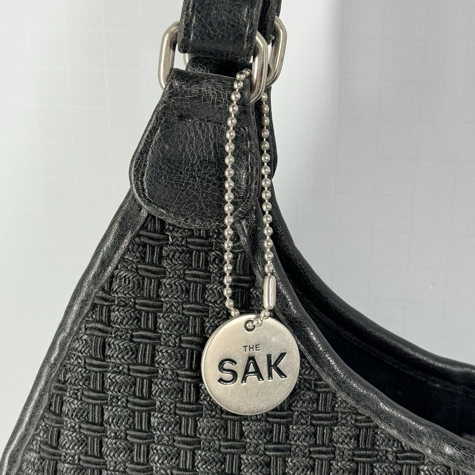 The Sak Woven Shoulder Bag Black Basket Weave Cotton Paper Faux Leather Boho