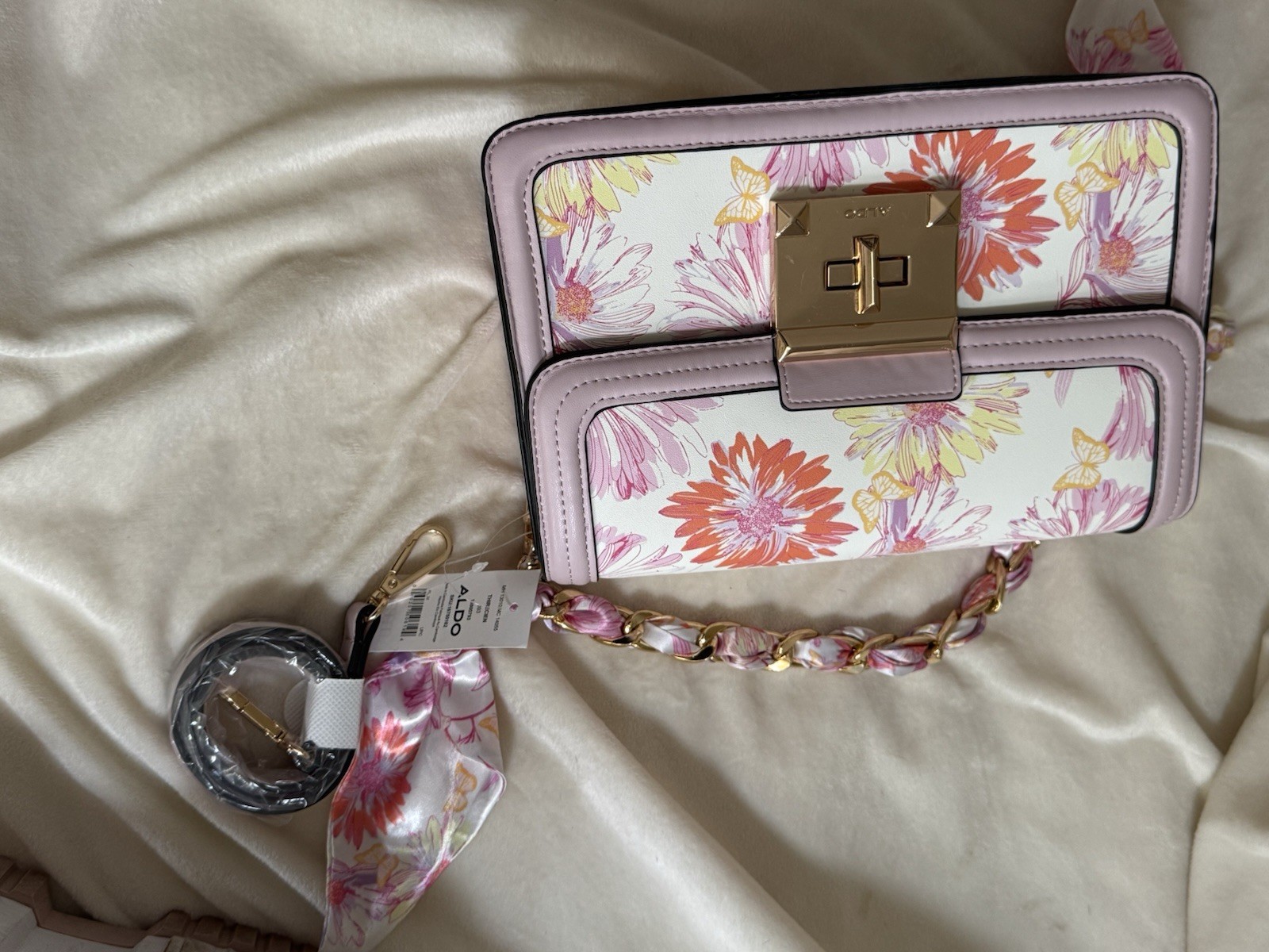 Brand new Aldo bag. 2 additional handle accessories. beautiful scarf wrapping.