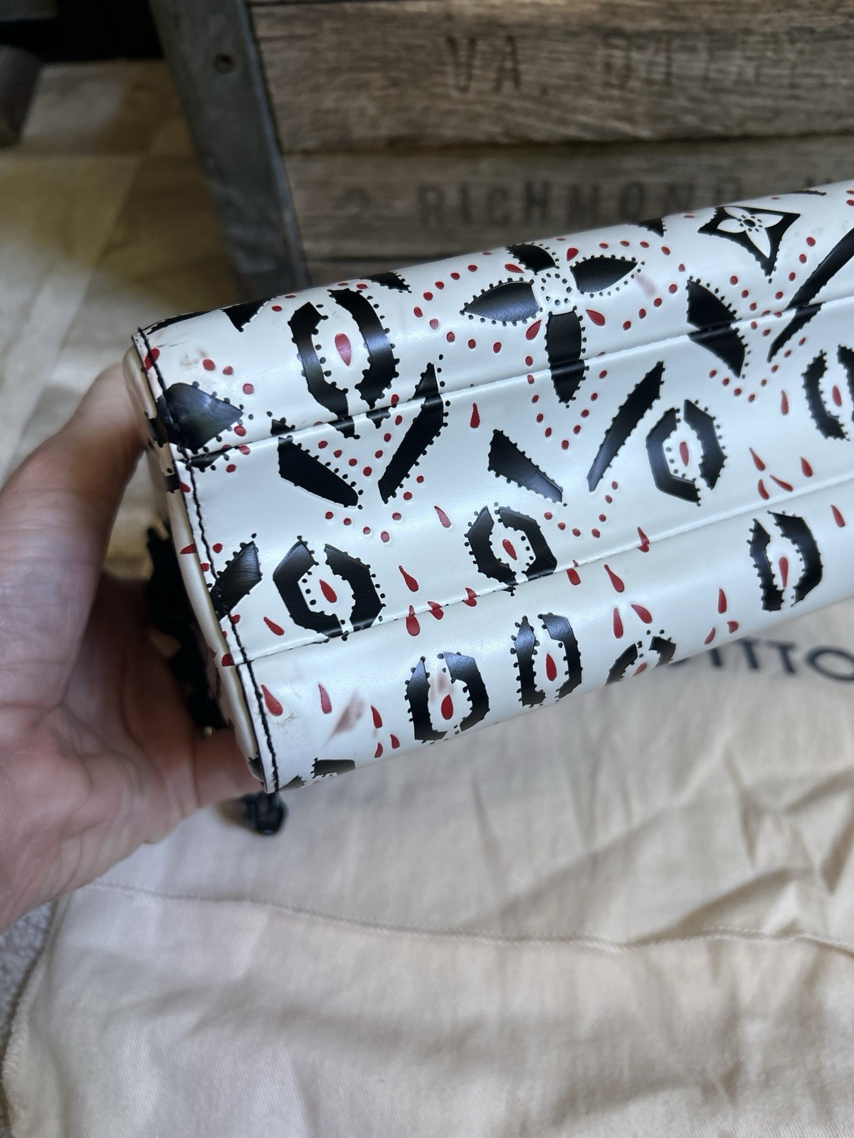 LOUIS VUITTON “Twist” black white red graphic print leather MM handbag