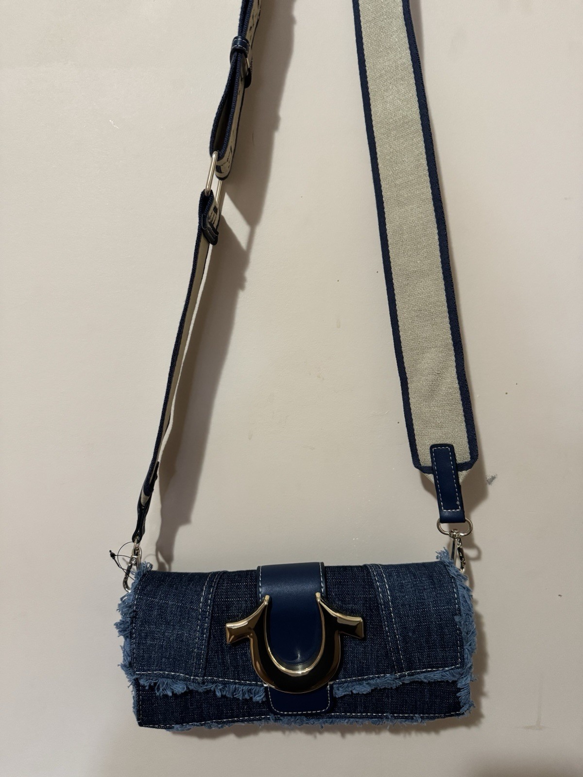 True Religion Blue Denim Shoulder Bag with Fringe Buckle Accent Gold Hardware