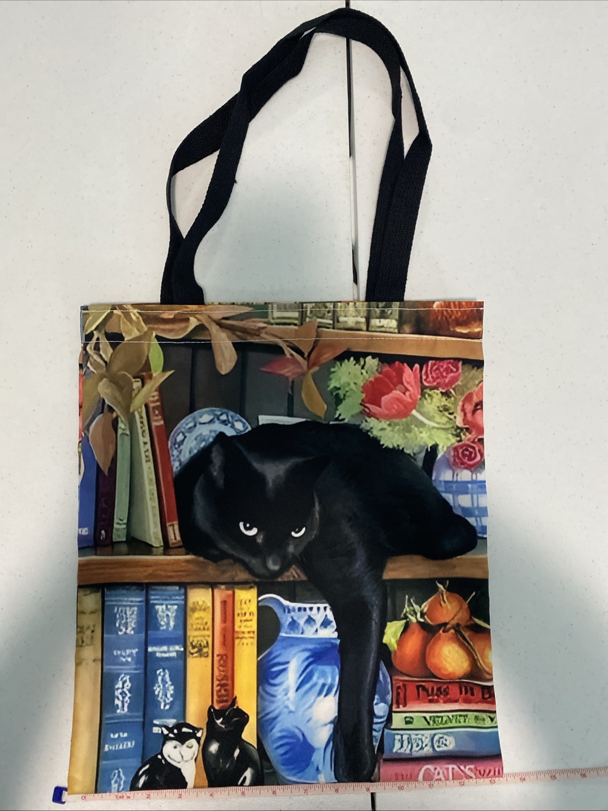 Black Cat Tote On Shelf with Books and Floral Design Canvas Bag