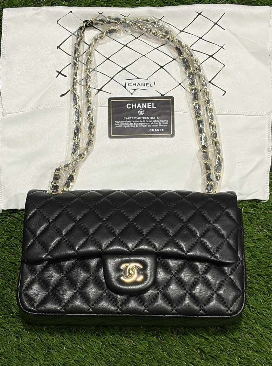 Black shoulder bag w/ original packaging and tags