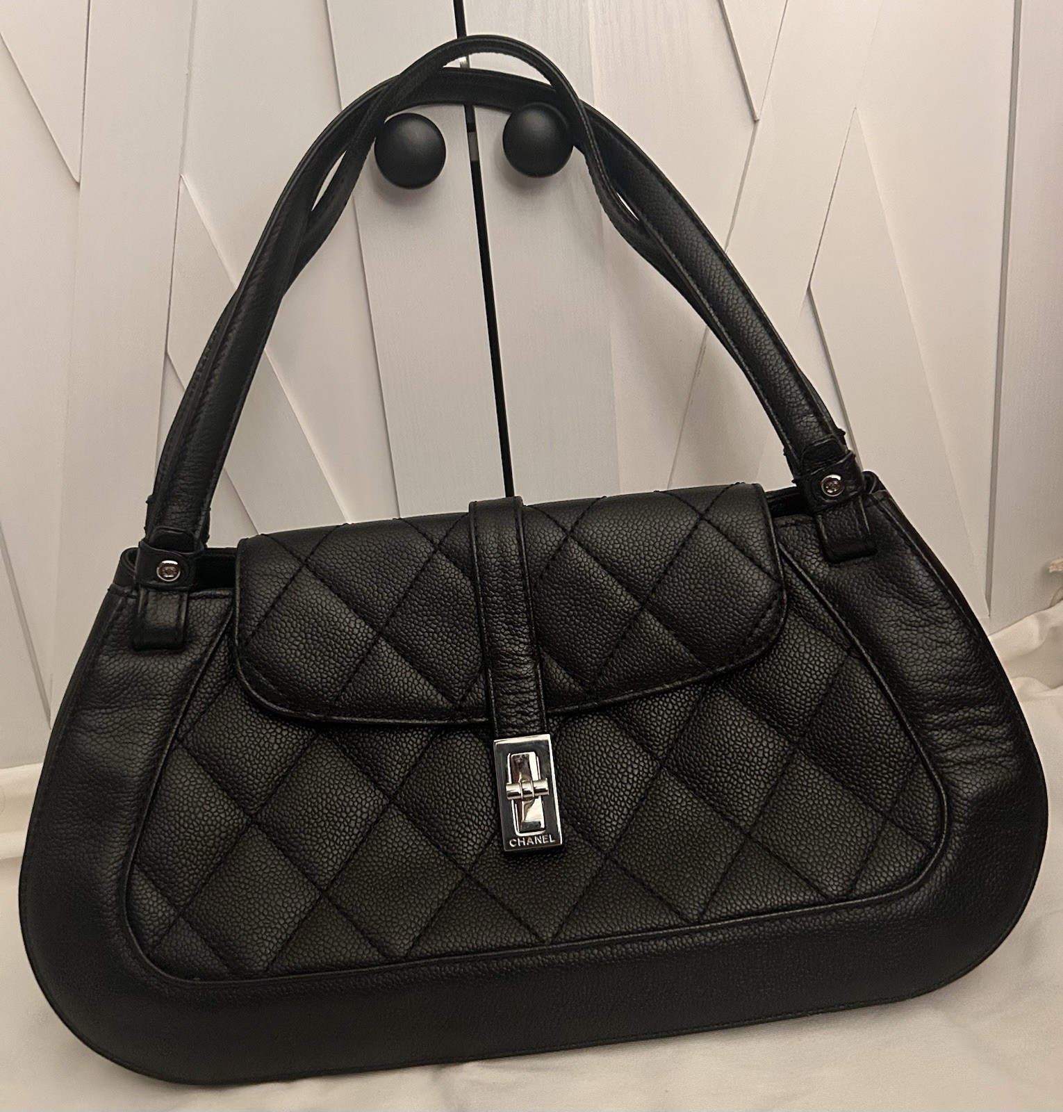 CHANEL Black Quilted Shoulder Bag with Turn Lock & Silver Hardware