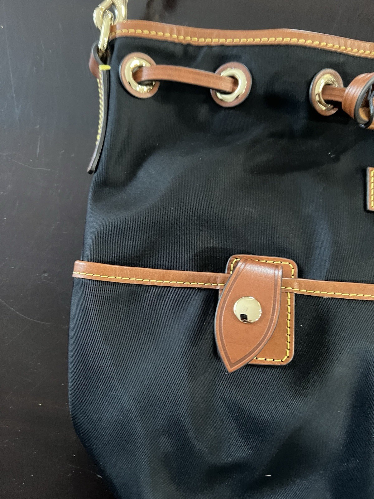 Dooney & Bourke Black Bucket Bag with Brown Leather Trim & Detachable Strap