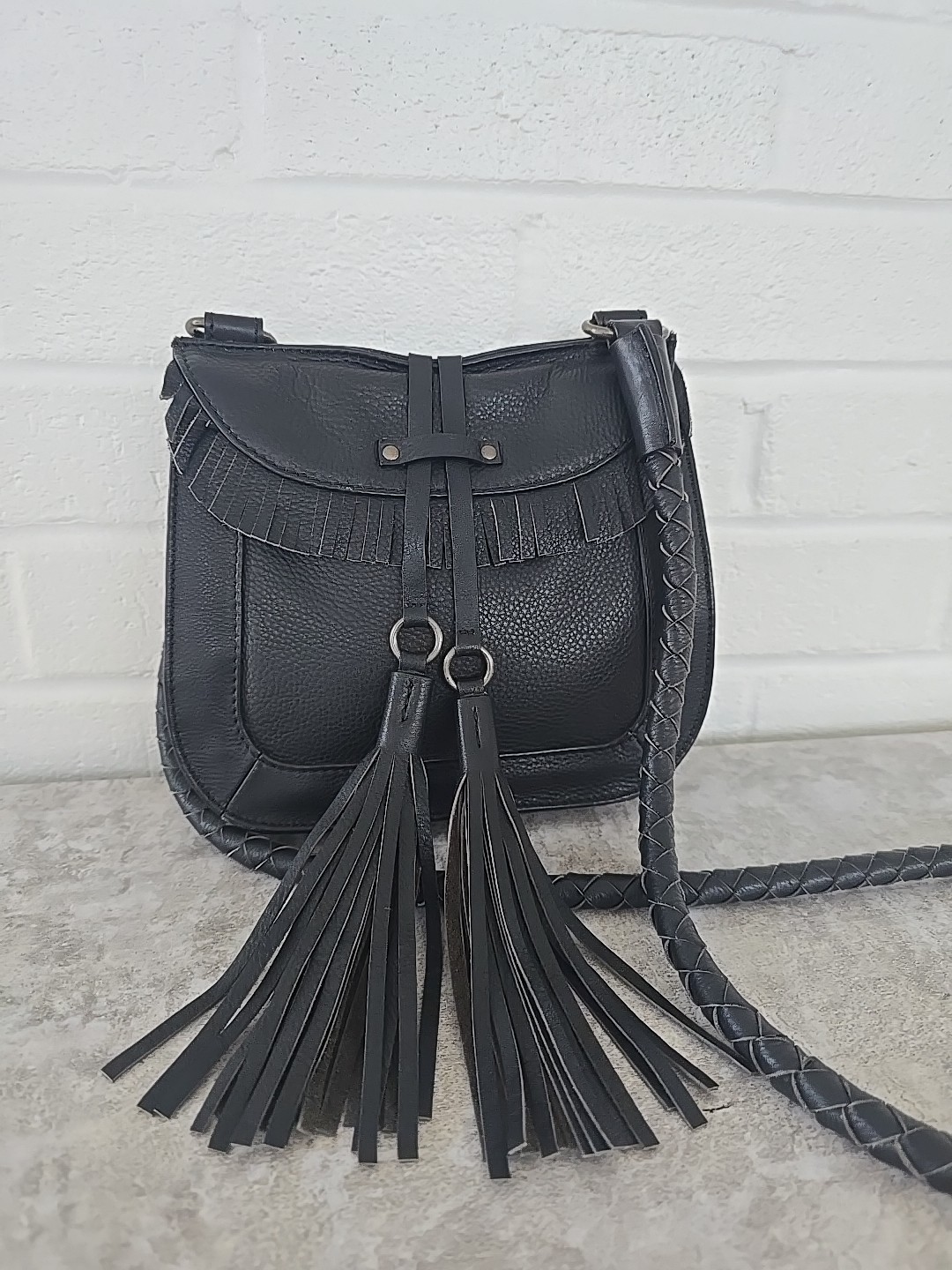 Joelle Hawkens Black Leather Crossbody Bag Front Flap and Decorative Tassels