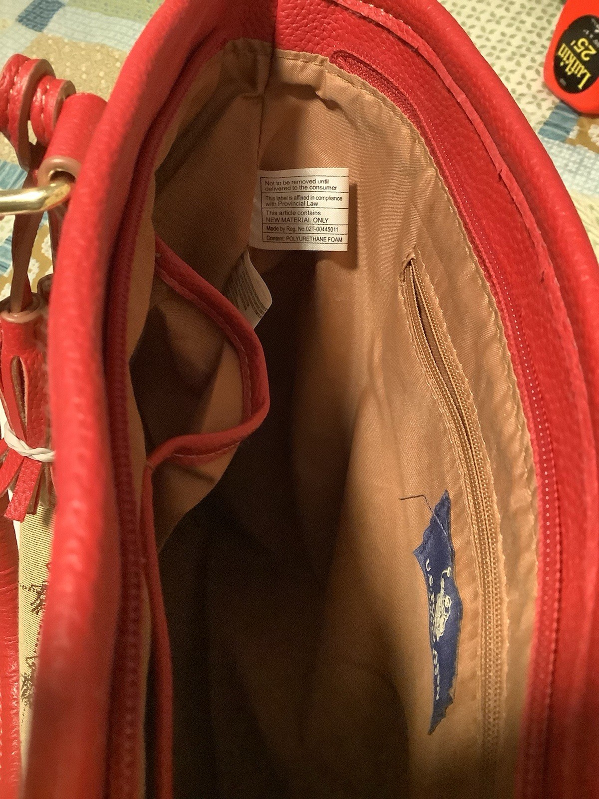Polo Assn. cotton-blended logo fabric shoulder bag w/red vinyl trim and handles.