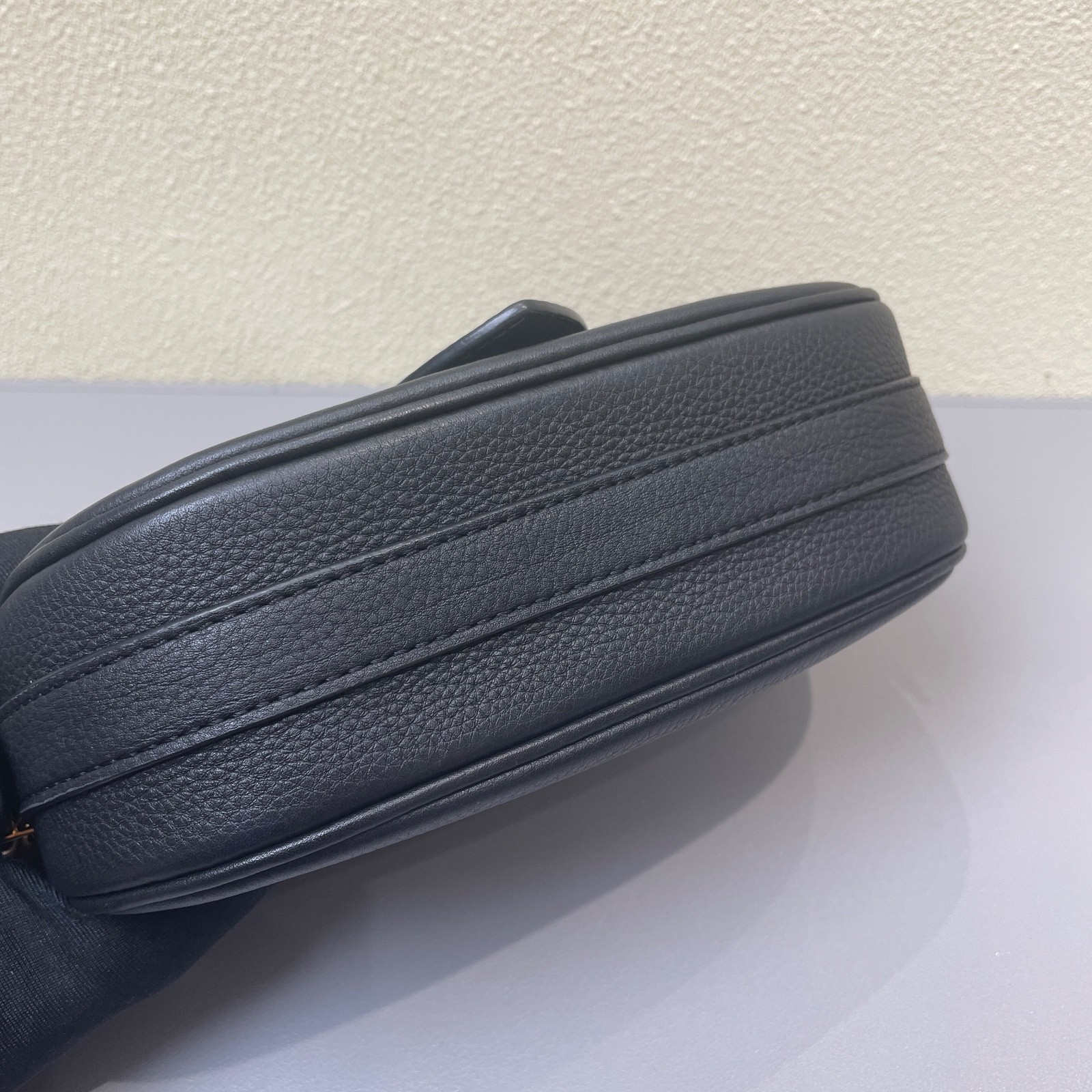 Louis Vuitton Pont 9 black calfskin crossbody bag with gold-tone hardware.