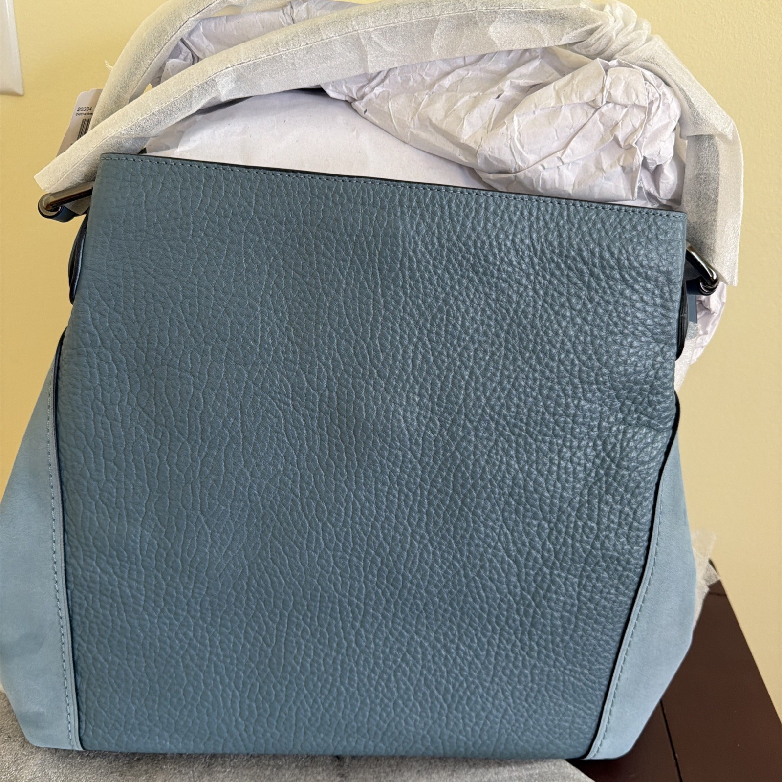 Edie leather handbag in Chambray (blue) with an original retail price of $495
