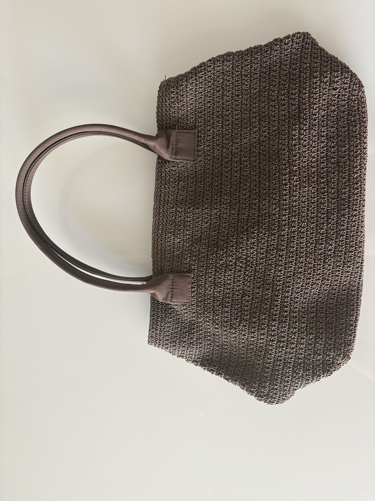 Tightly Woven bag Brown .68% Cotton/32 % olefin with man made material trim.