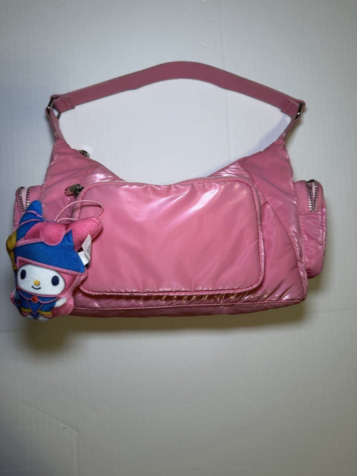 Pink faux patent leather handbag with Hello Kitty My Melody Dark Magician charm