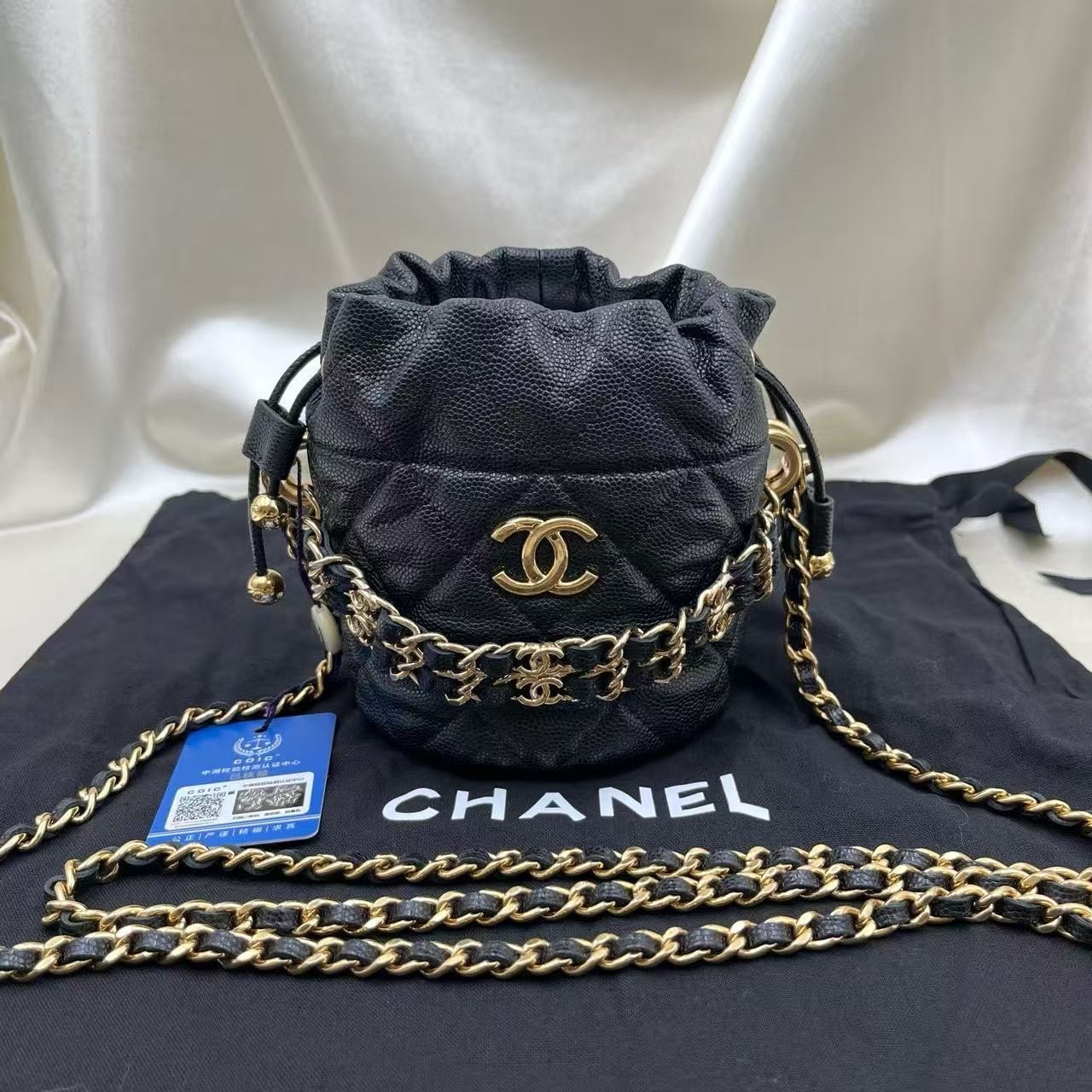 Chanel 22K Fall Black Caviar Leather Drawstring Mini Bucket Bag