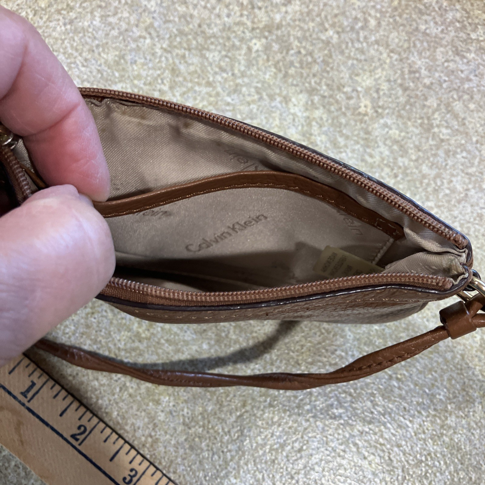 Calvin Klein brown leather wristlet 7 inL X 0.5 W X 5 In H