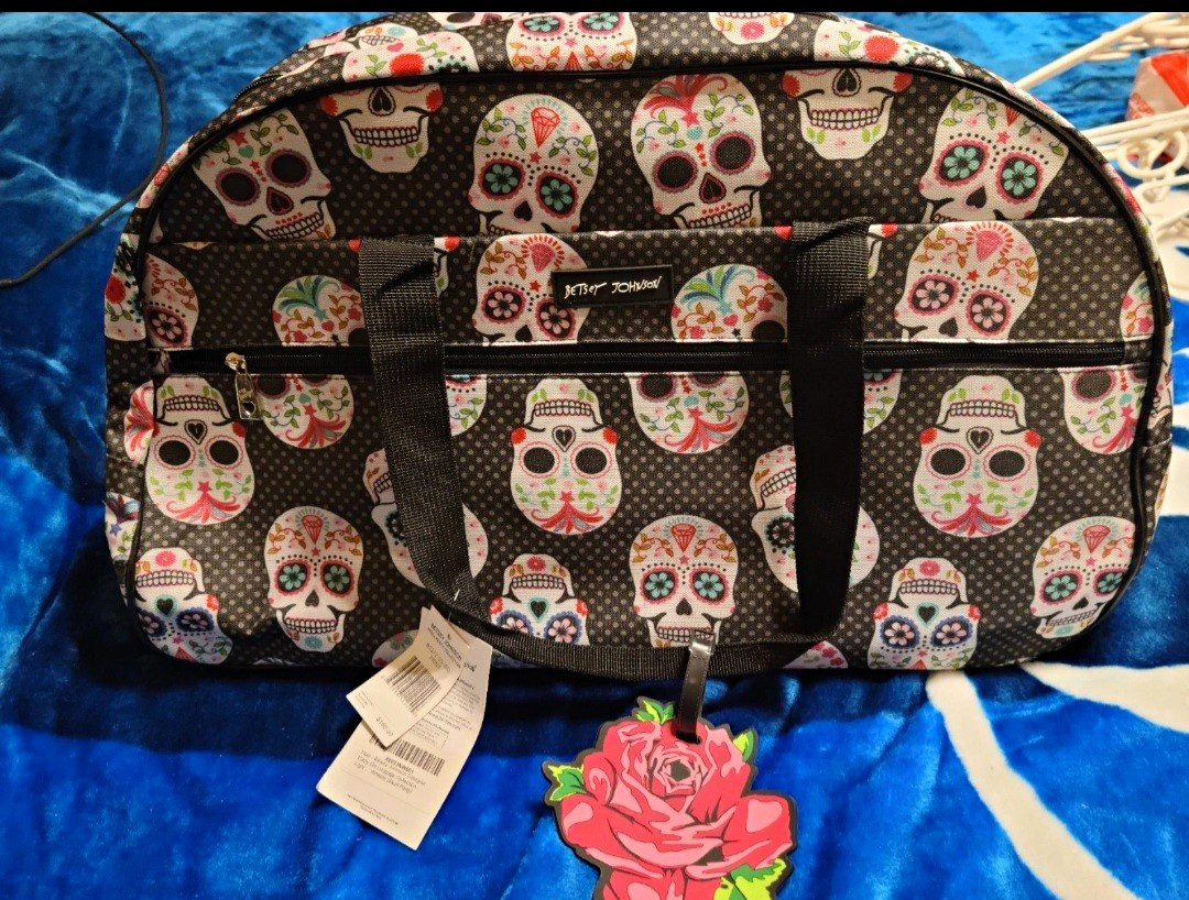 Betsey Johnson Skull Party Rolling Carry-On Bag, Skull Print, Tag & Charm