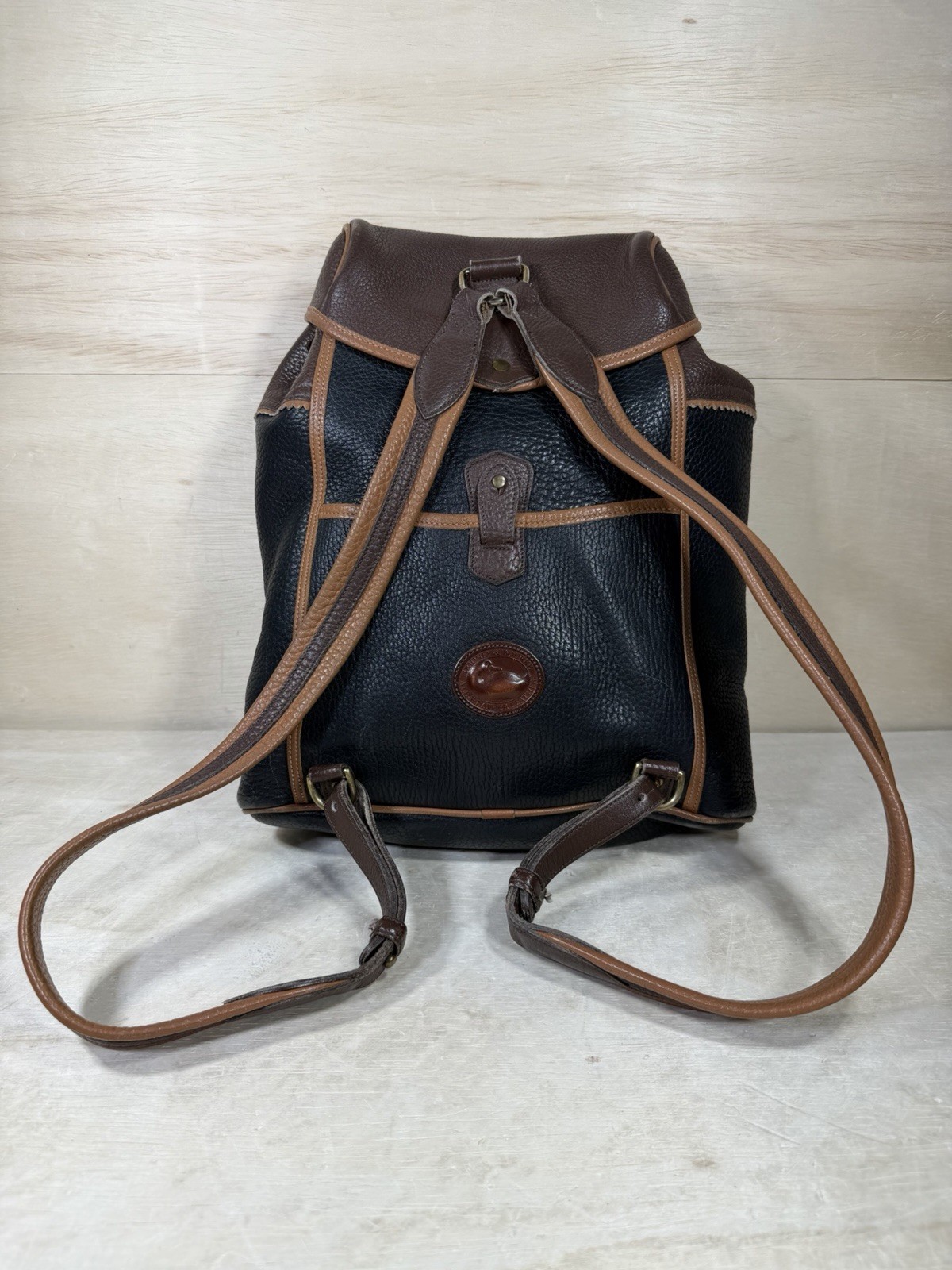 Vintage Dooney & Bourke Black Brown Pebbled Leather Drawstring Backpack Tassels